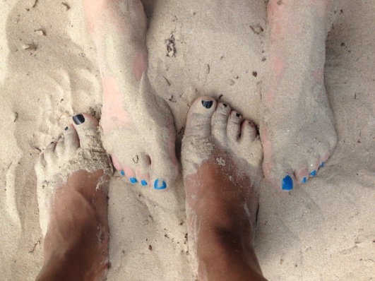 Our feet in the sands of the Sandbanks Provincial Park 's Outlet beach.